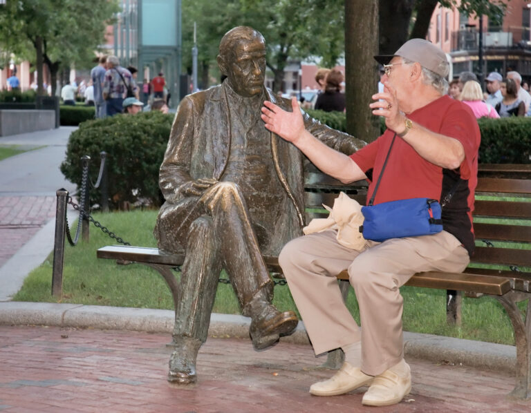 A friendly conversation between seniors in Boston Park, Mass. View the Entire humoristic Senior series